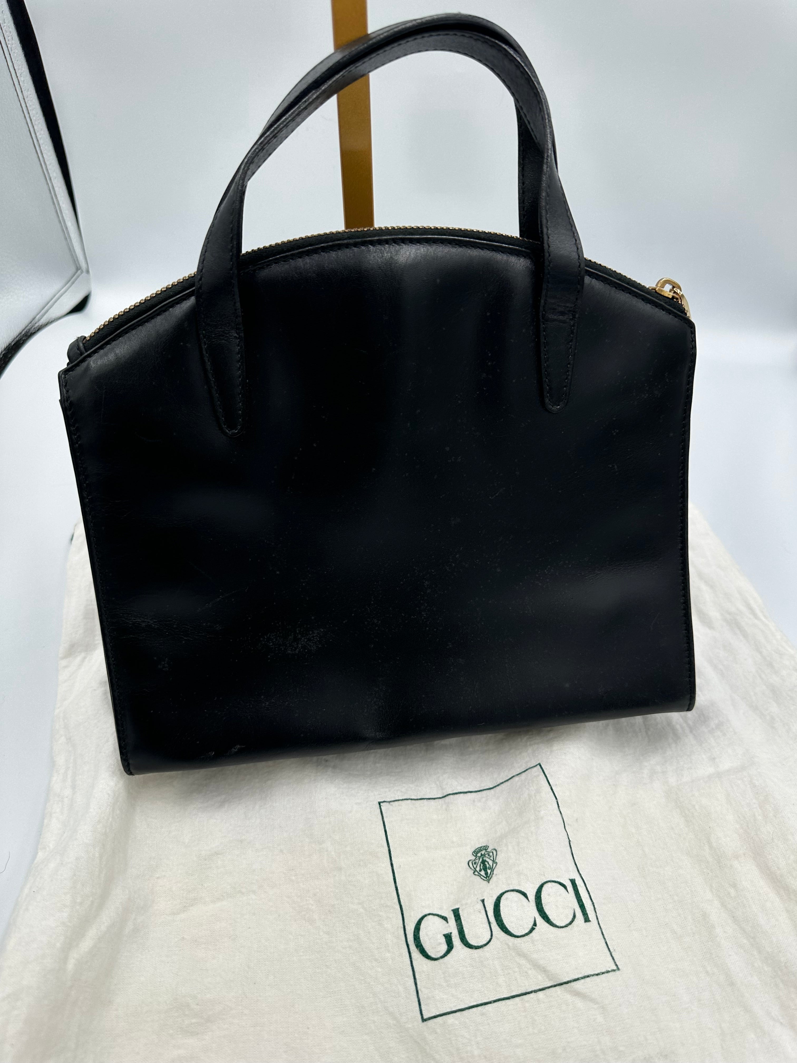90’s Gucci Jackie black leather handbag with G gold hardware zip