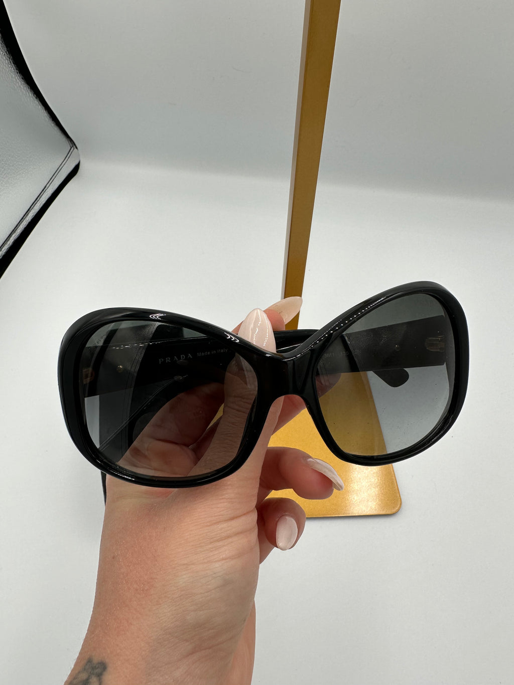 Prada Heritage black sunglasses with gold logo
