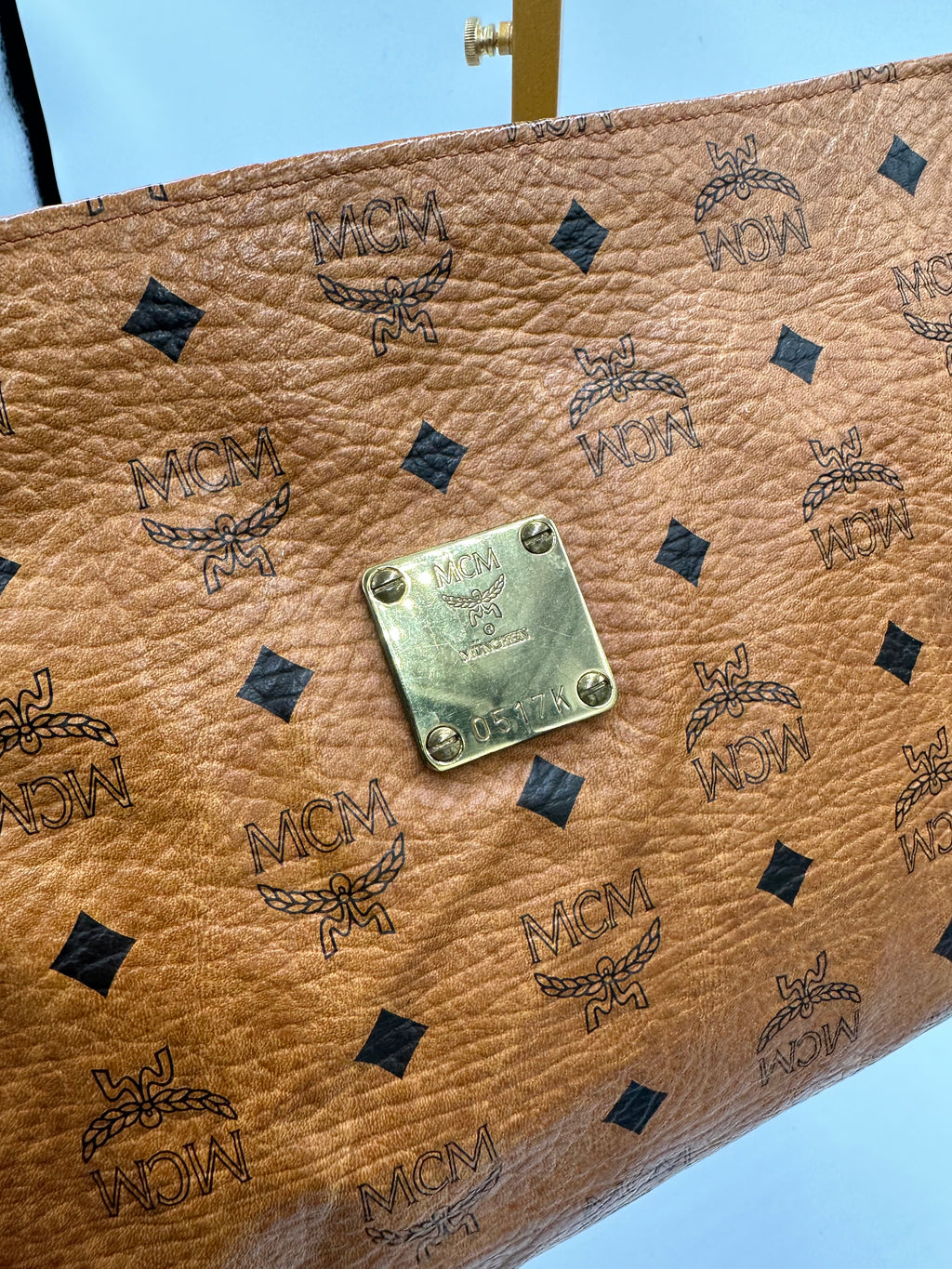MCM Visetus Leather clutch bag with gold hardware unisex