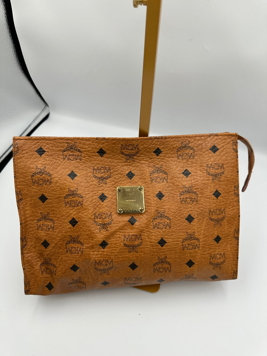 MCM Visetus Leather clutch bag with gold hardware unisex
