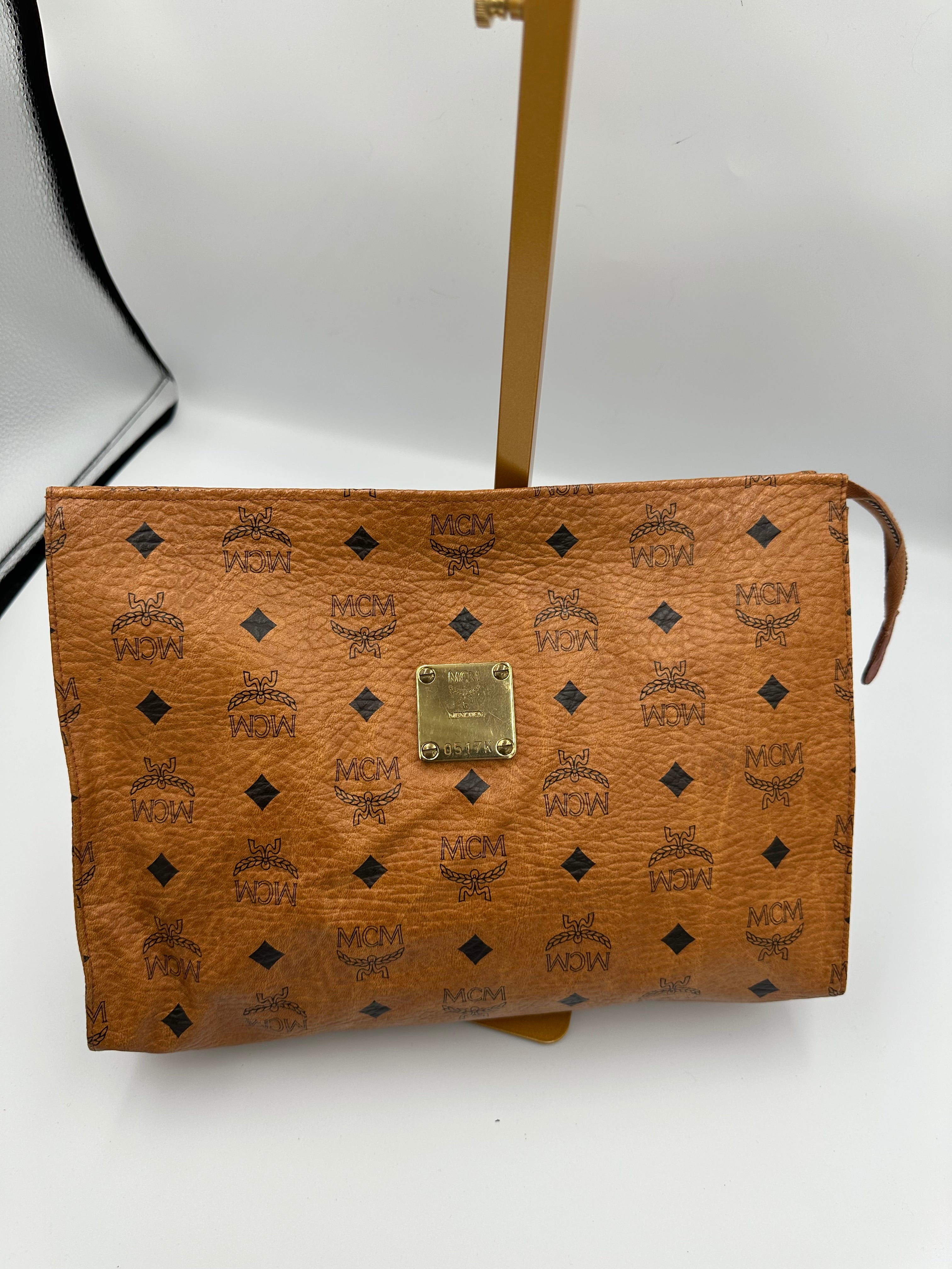 MCM Visetus Leather clutch bag with gold hardware unisex