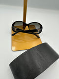Prada Heritage black sunglasses with gold logo