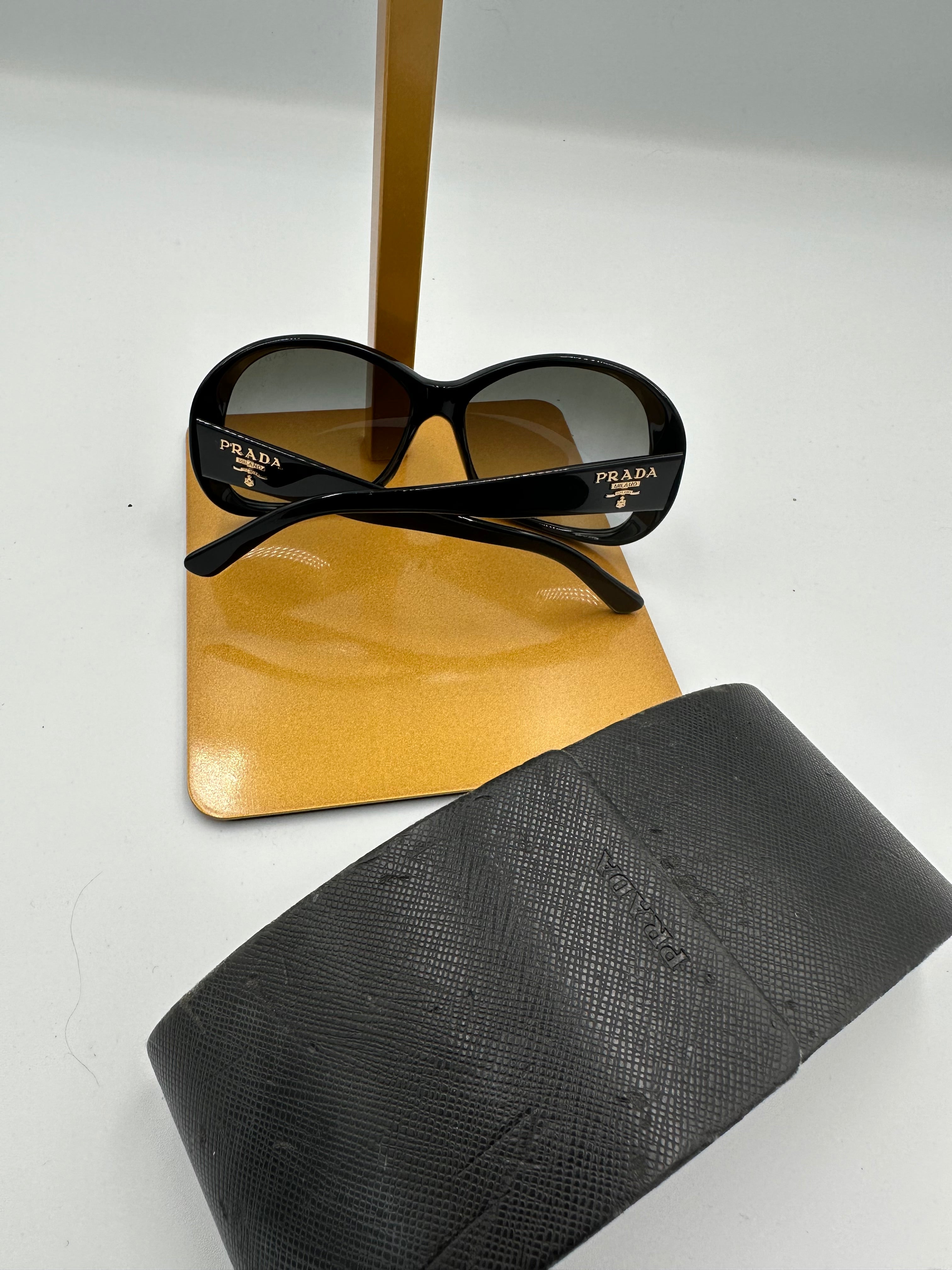 Prada Heritage black sunglasses with gold logo