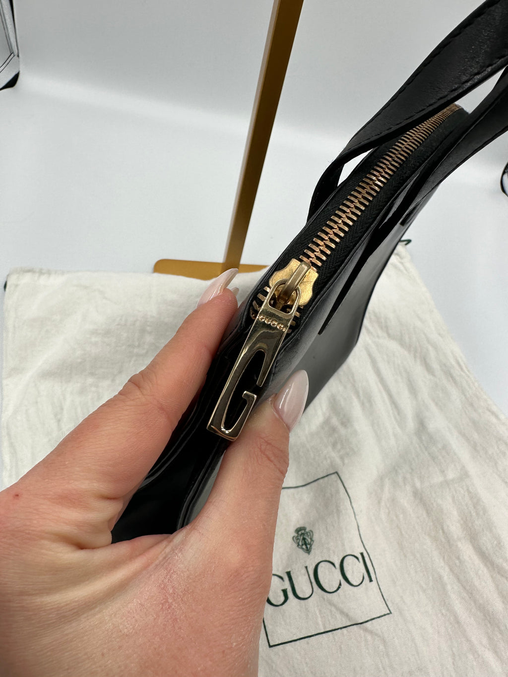 90’s Gucci Jackie black leather handbag with G gold hardware zip