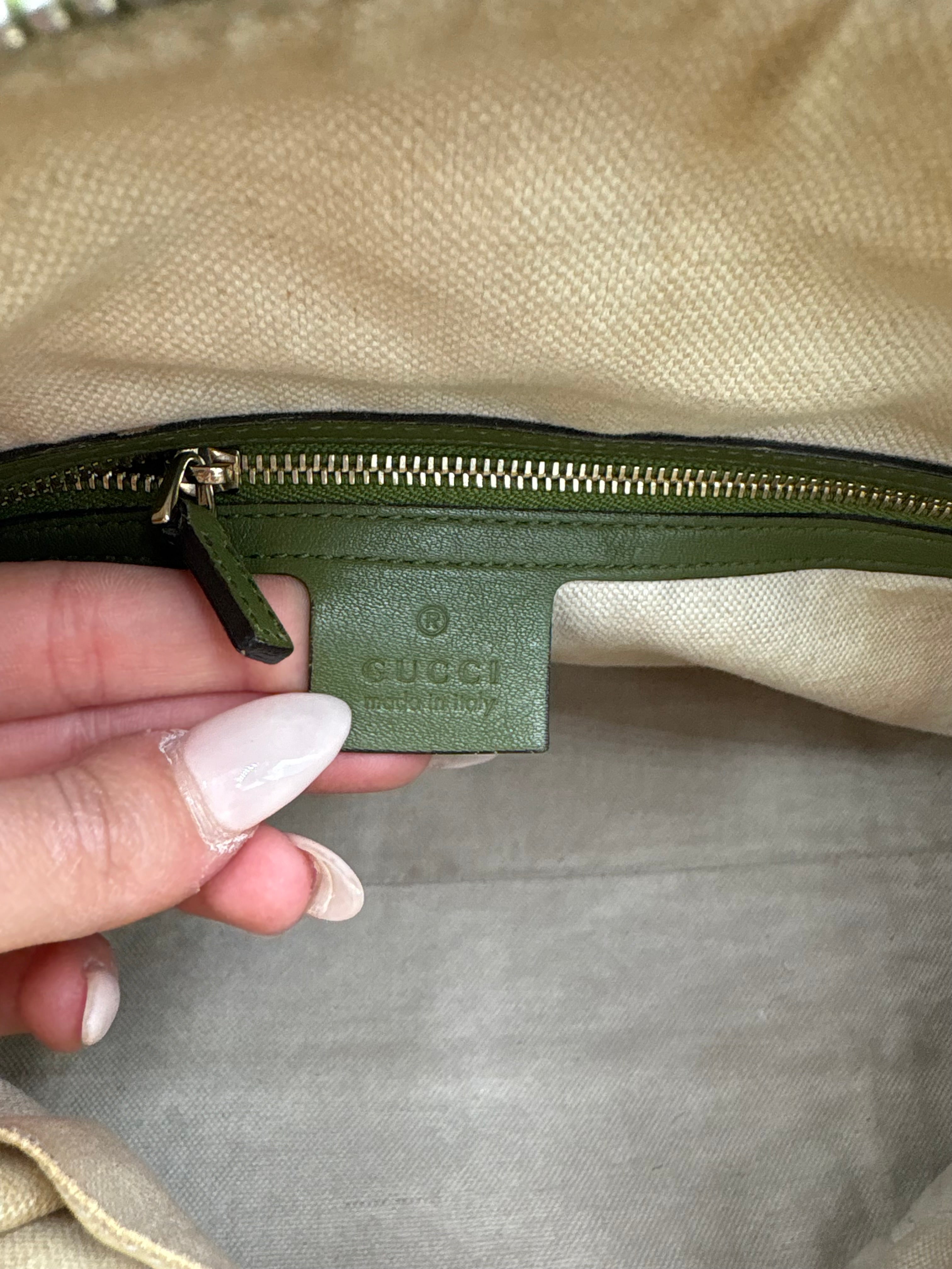 Gucci Ophidia dome top handle bag featuring monogram GG supreme canvas
