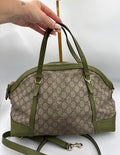 Gucci Ophidia dome top handle bag featuring monogram GG supreme canvas