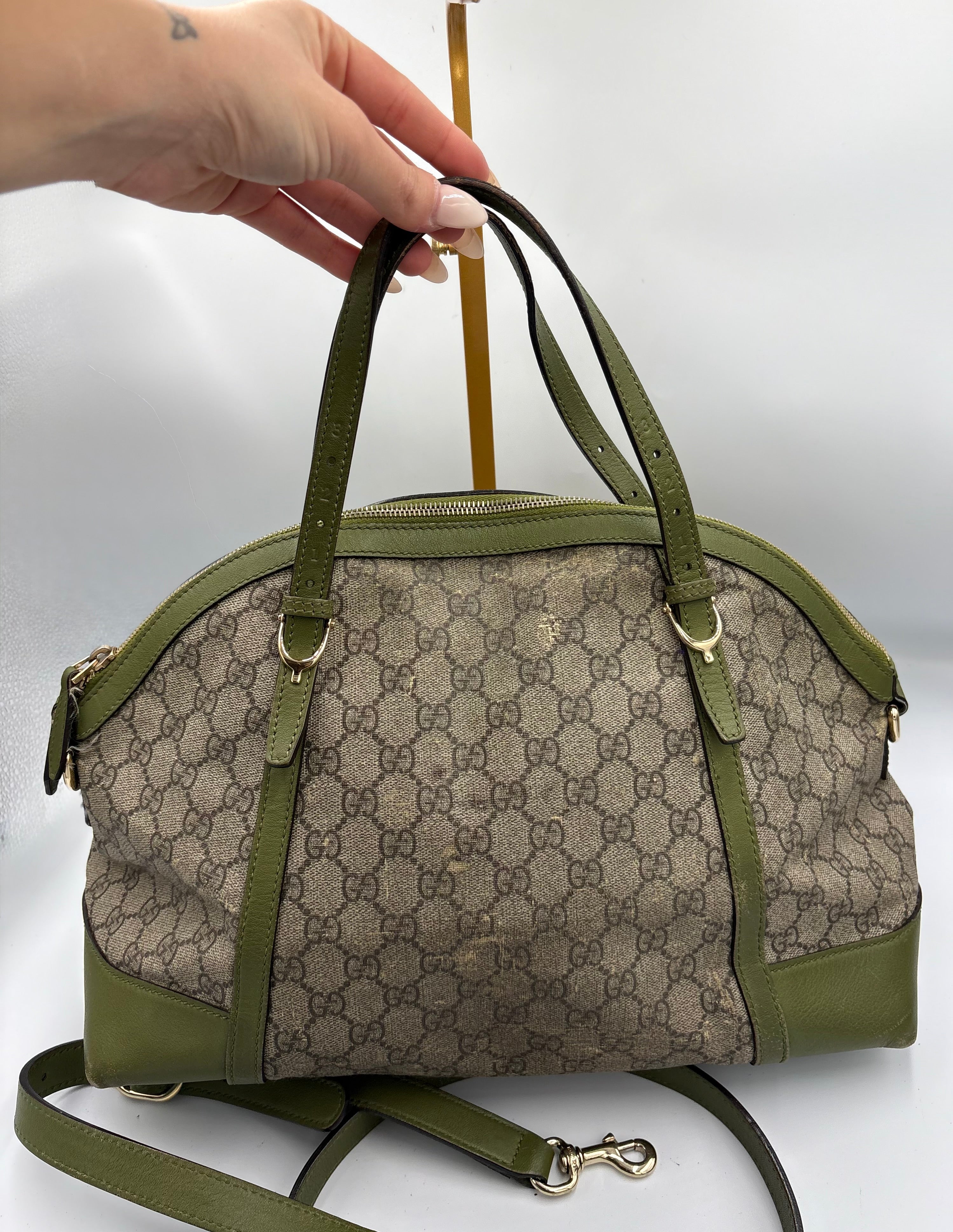 Gucci Ophidia dome top handle bag featuring monogram GG supreme canvas
