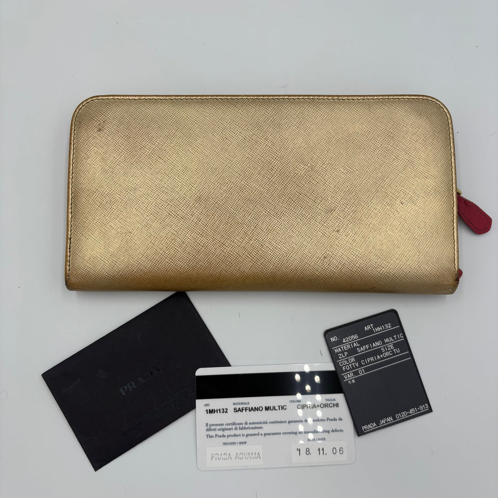 Gold Prada trifold wallet/ purse with pink interior