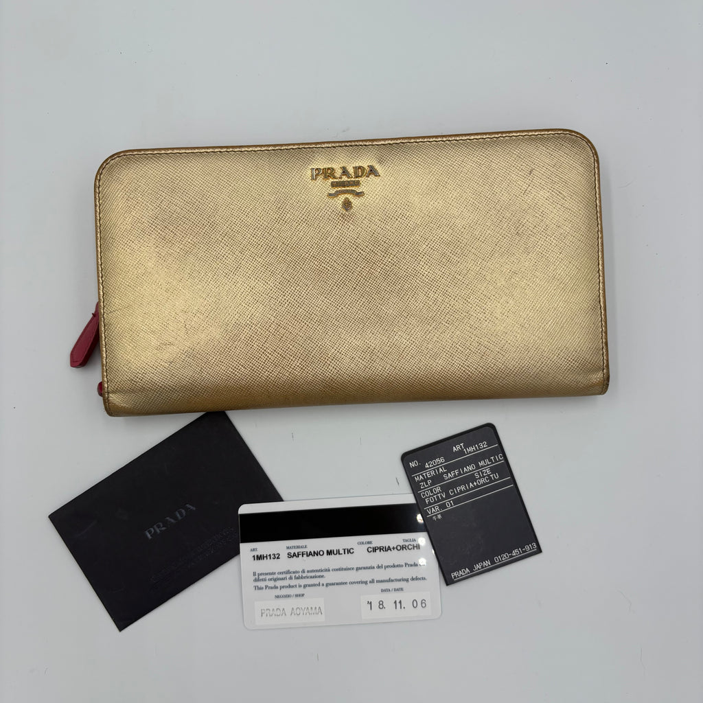 Gold Prada trifold wallet/ purse with pink interior