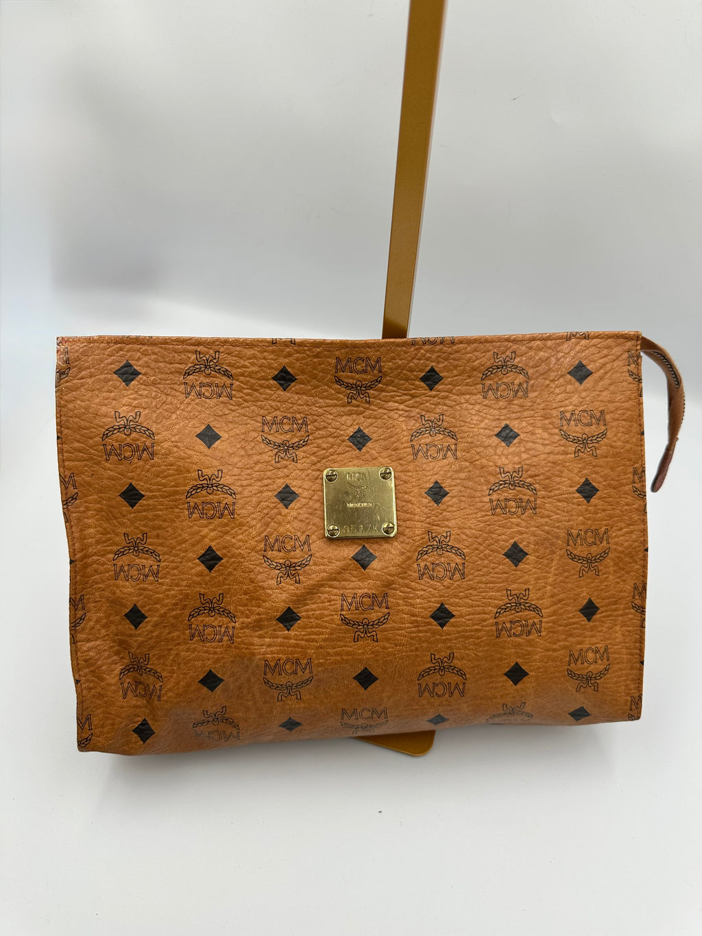 MCM Visetus Leather clutch bag with gold hardware unisex