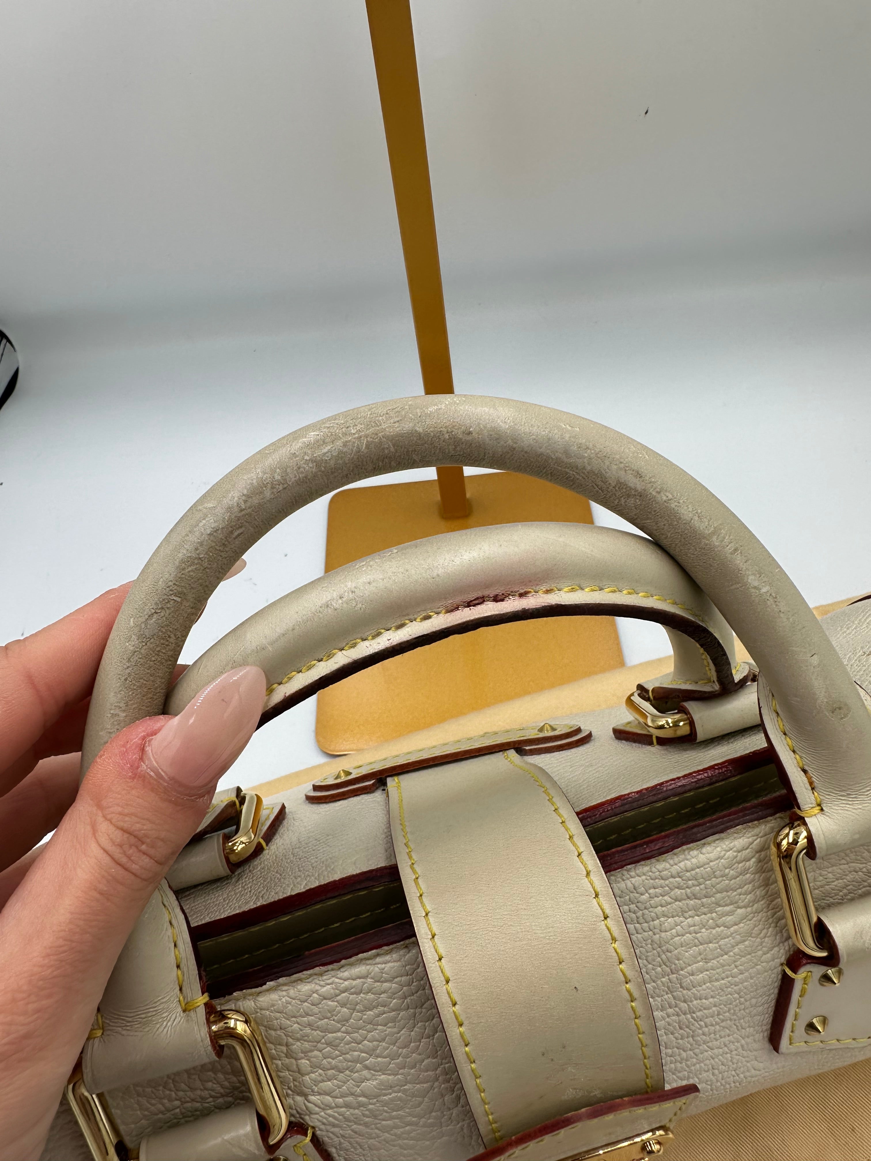 Louis Vuitton L'Epanoui PM handbag crafted from white Suhali goat leather