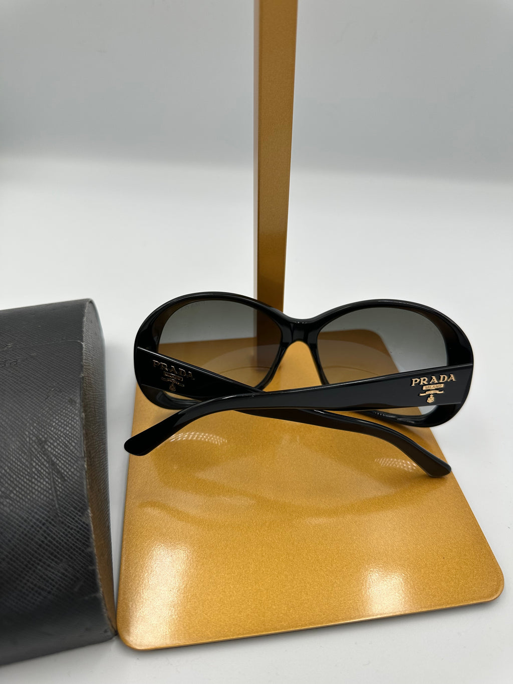 Prada Heritage black sunglasses with gold logo