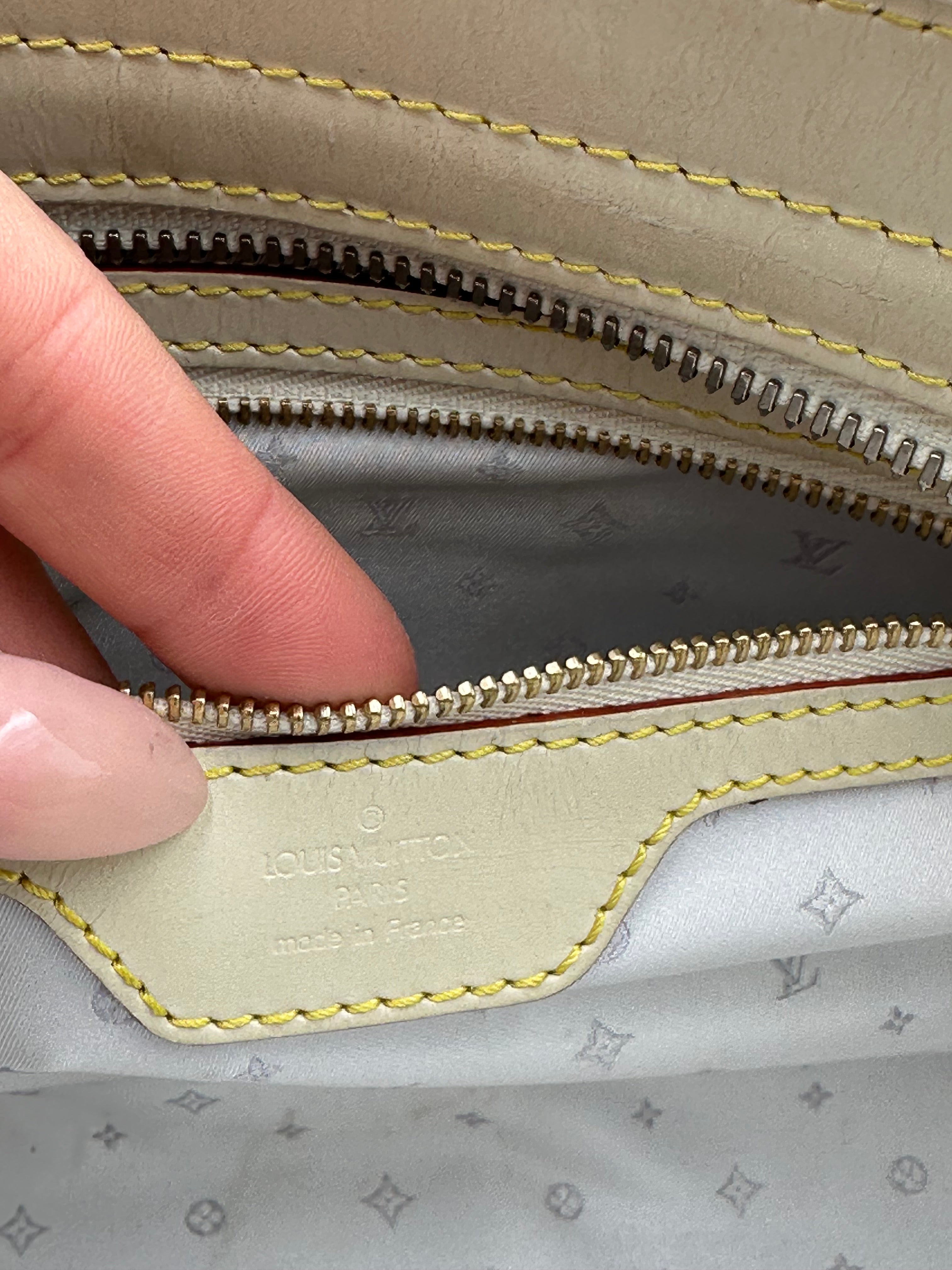 Louis Vuitton L'Epanoui PM handbag crafted from white Suhali goat leather