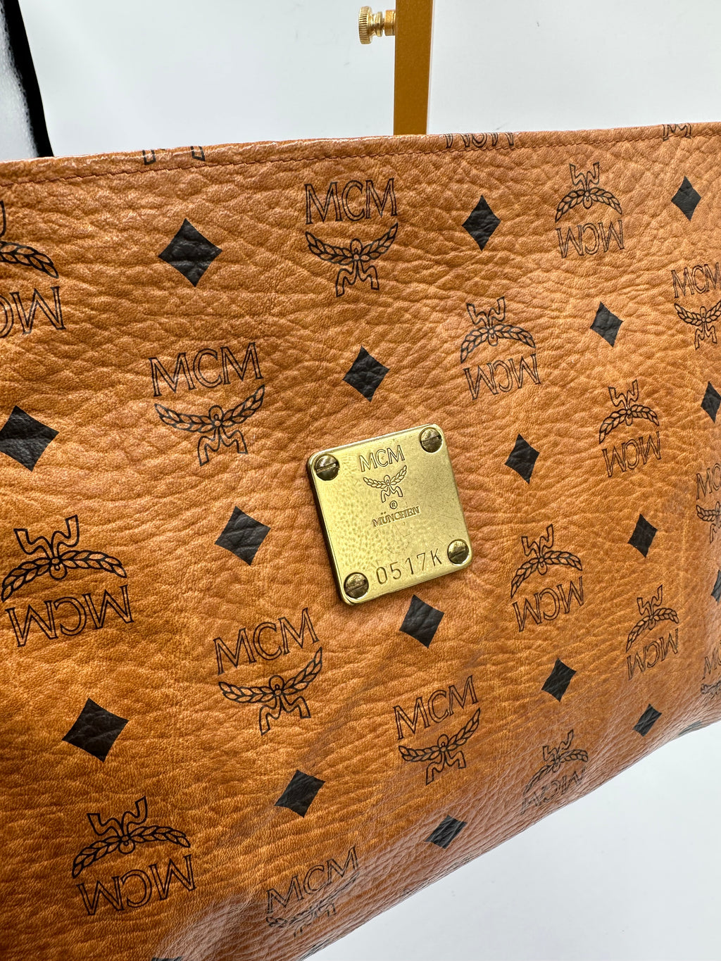 MCM Visetus Leather clutch bag with gold hardware unisex
