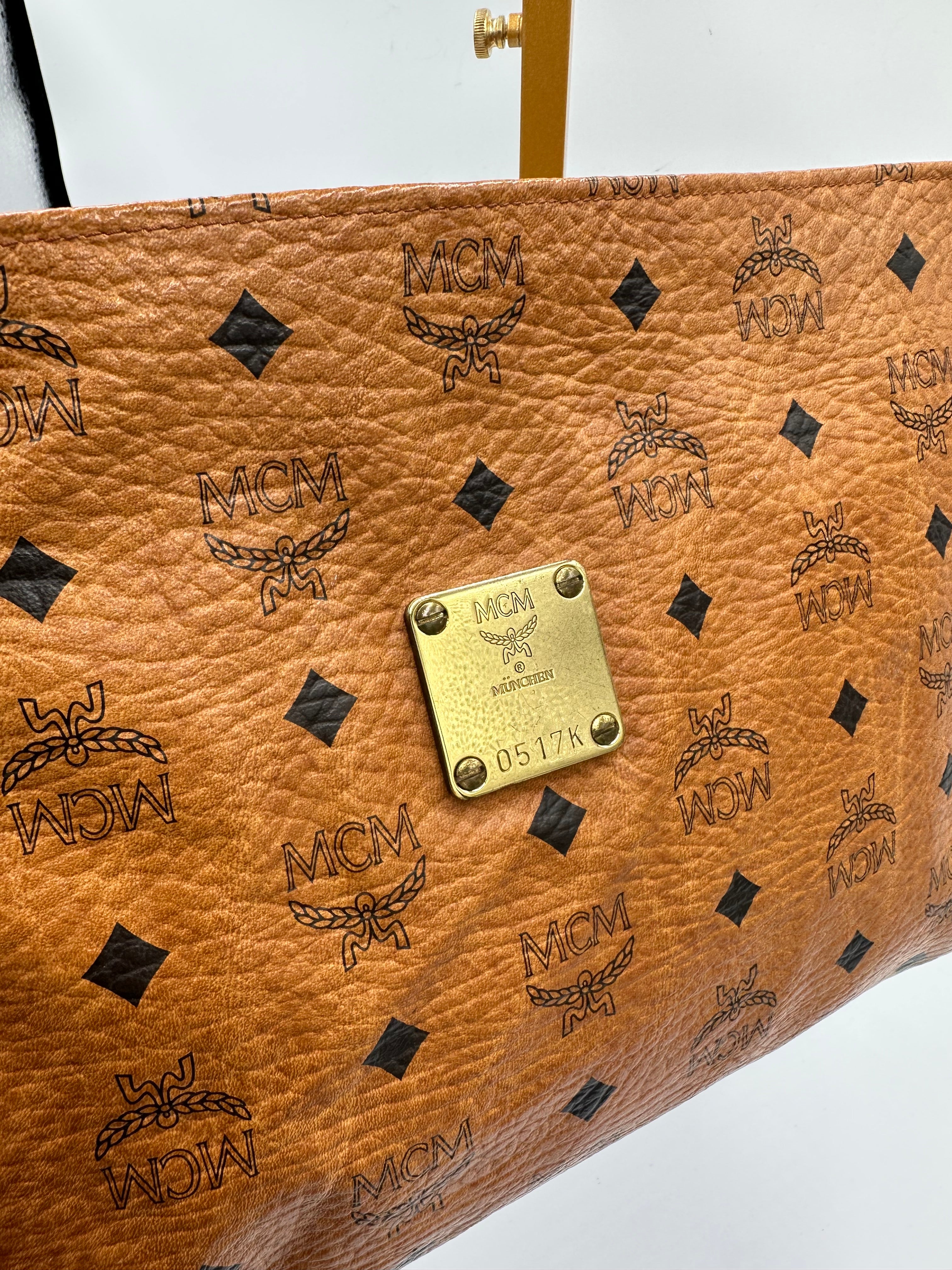 MCM Visetus Leather clutch bag with gold hardware unisex
