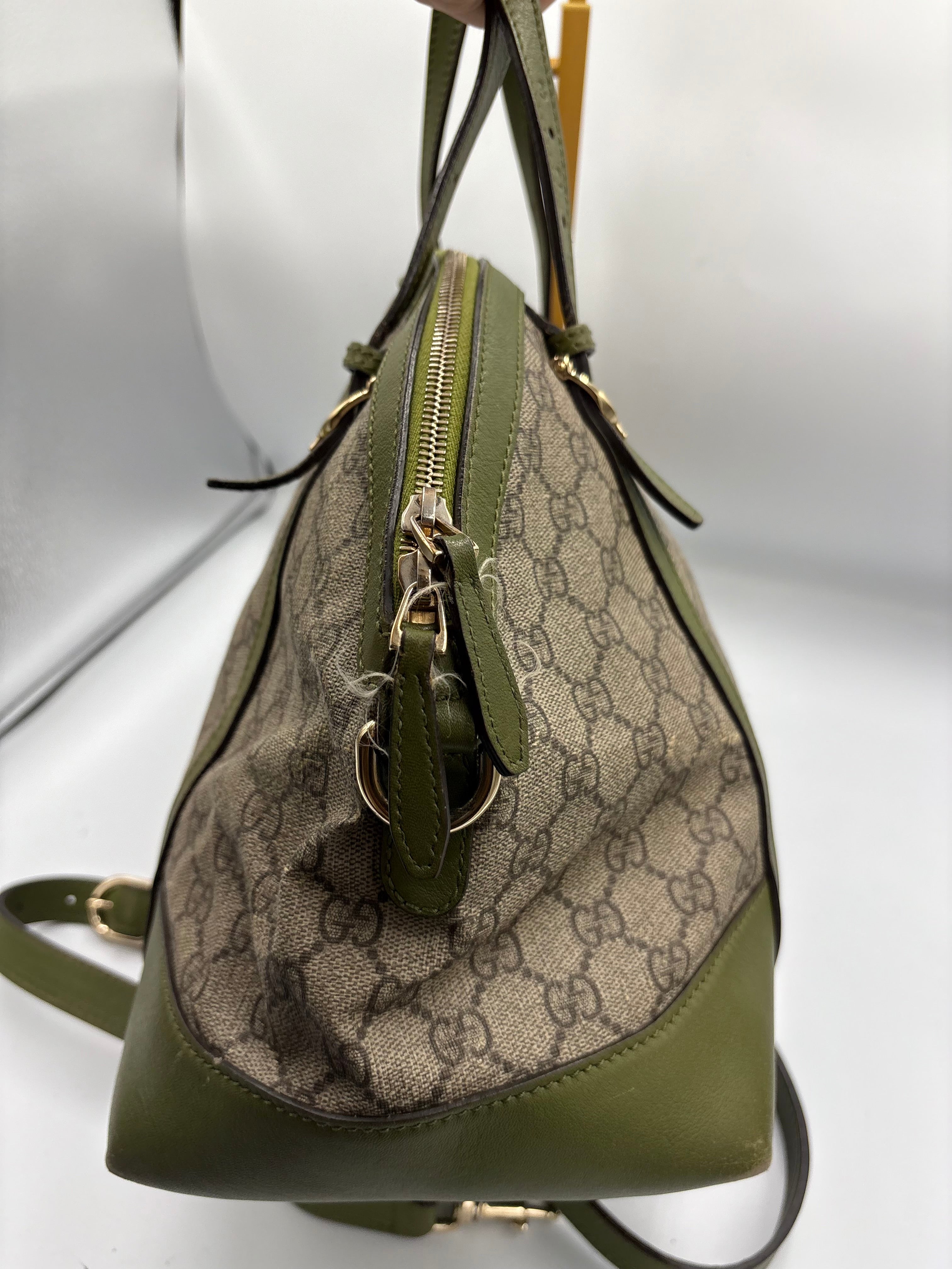 Gucci Ophidia dome top handle bag featuring monogram GG supreme canvas