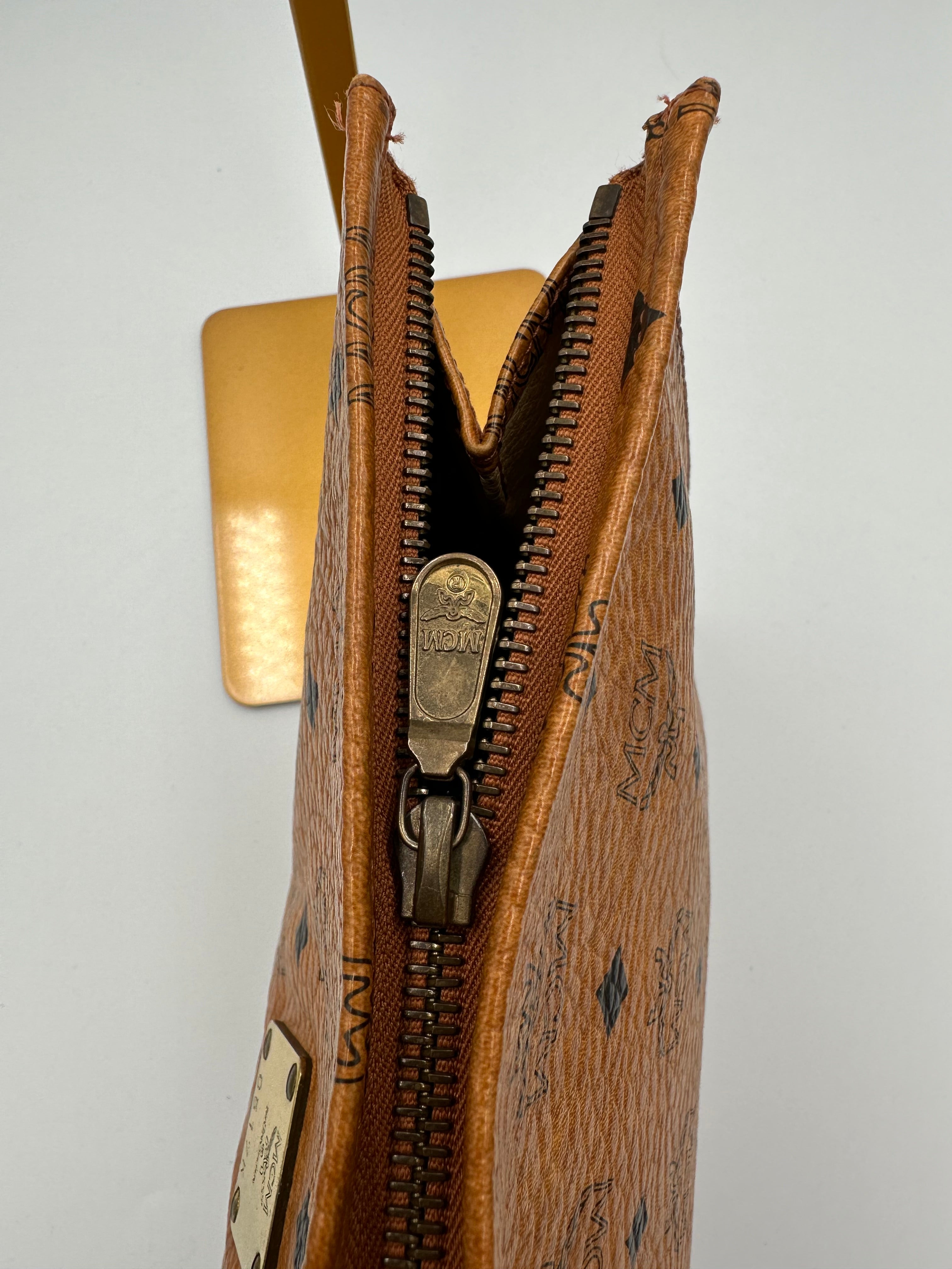MCM Visetus Leather clutch bag with gold hardware unisex