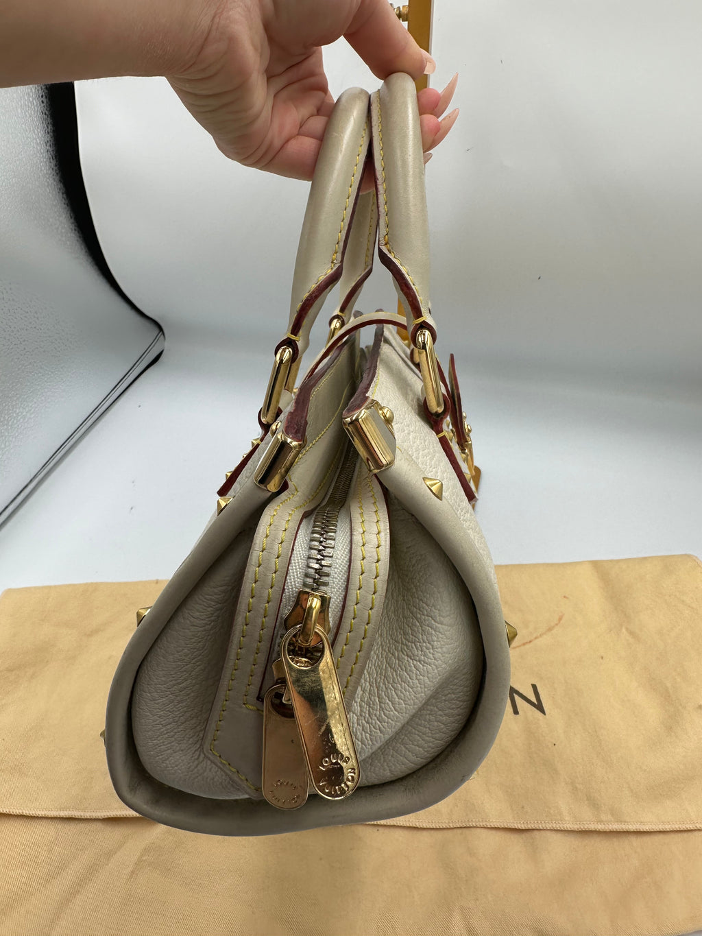 Louis Vuitton L'Epanoui PM handbag crafted from white Suhali goat leather