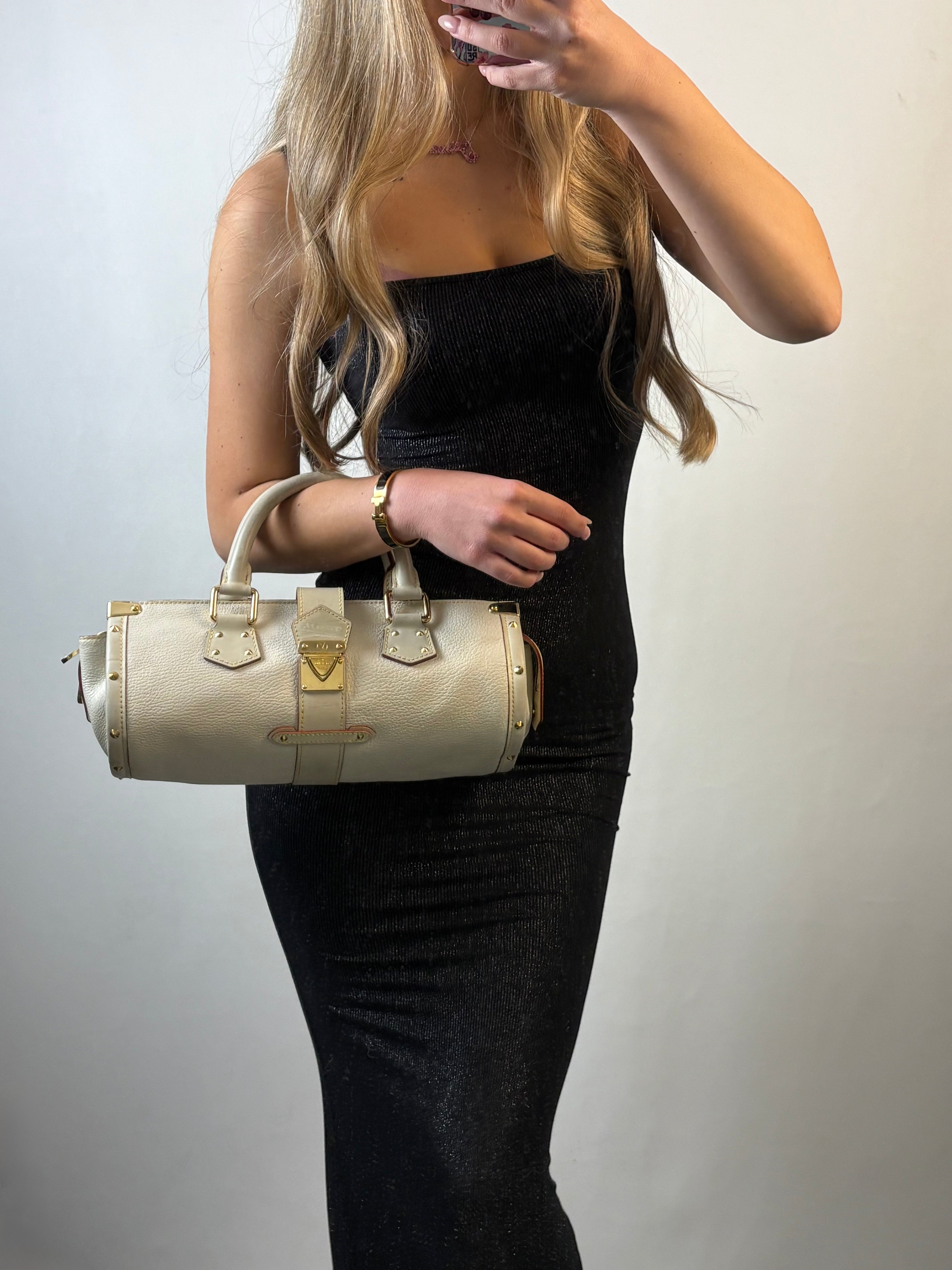 Louis Vuitton L'Epanoui PM handbag crafted from white Suhali goat leather