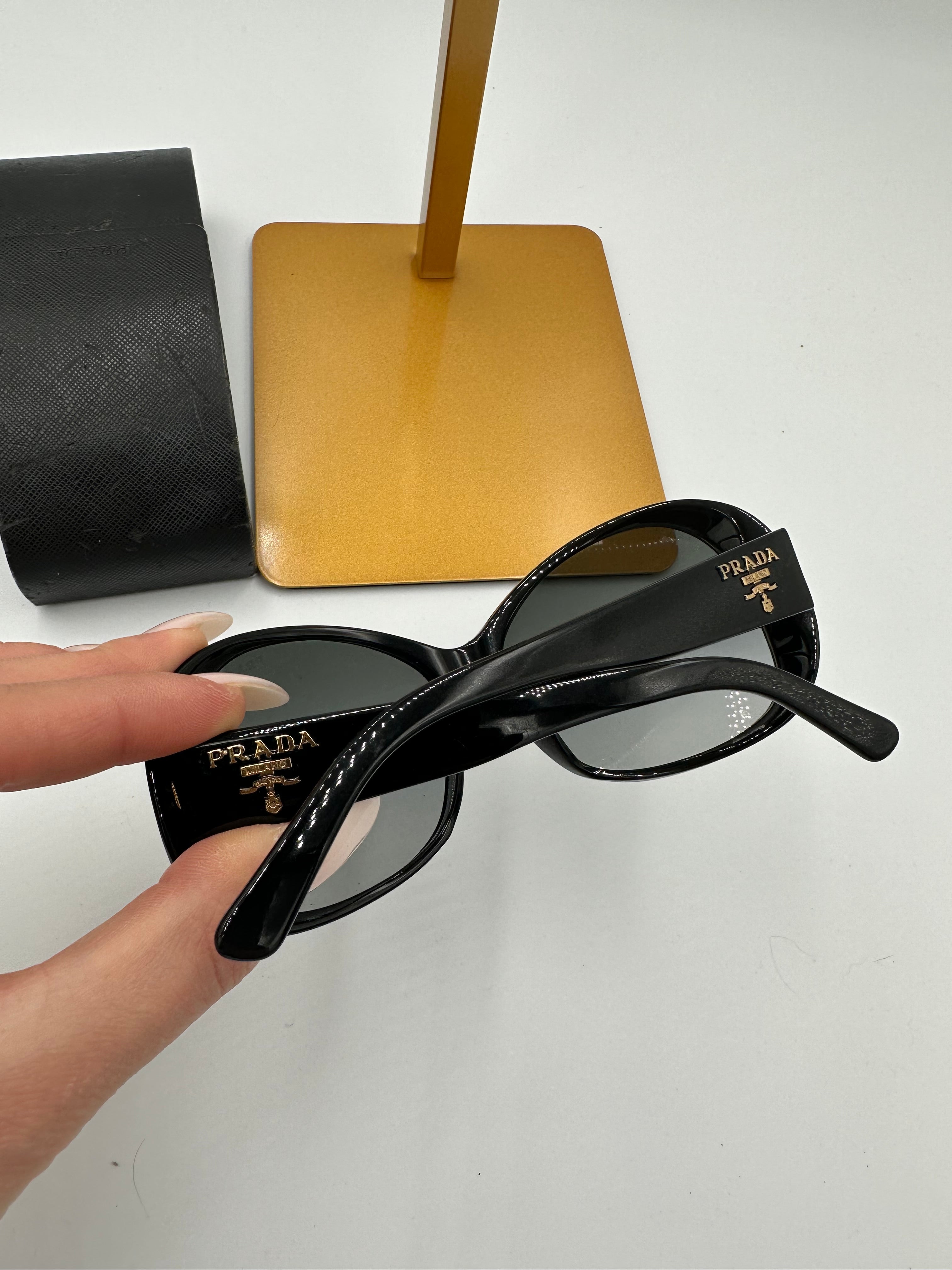 Prada Heritage black sunglasses with gold logo