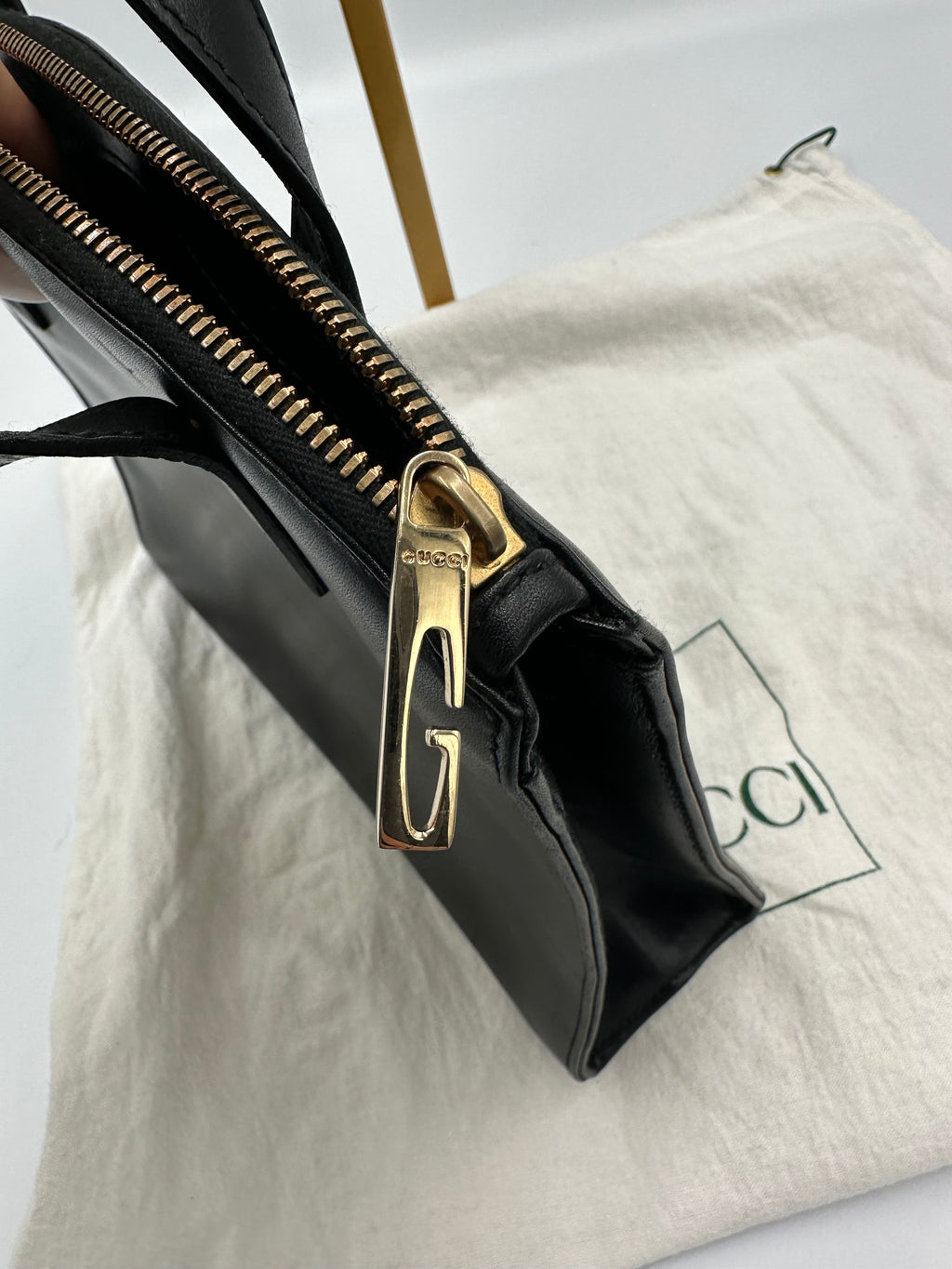 90’s Gucci Jackie black leather handbag with G gold hardware zip