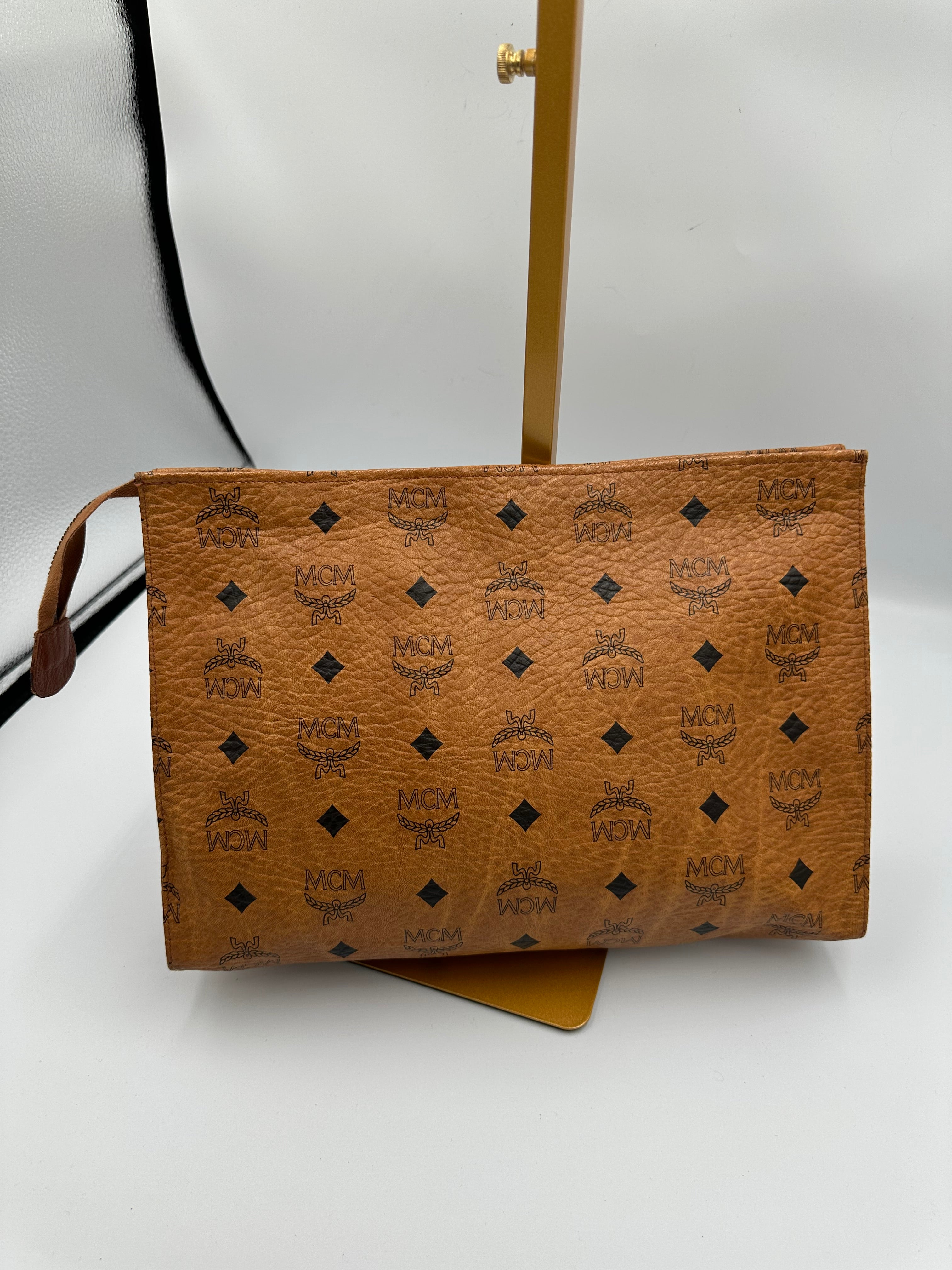 MCM Visetus Leather clutch bag with gold hardware unisex