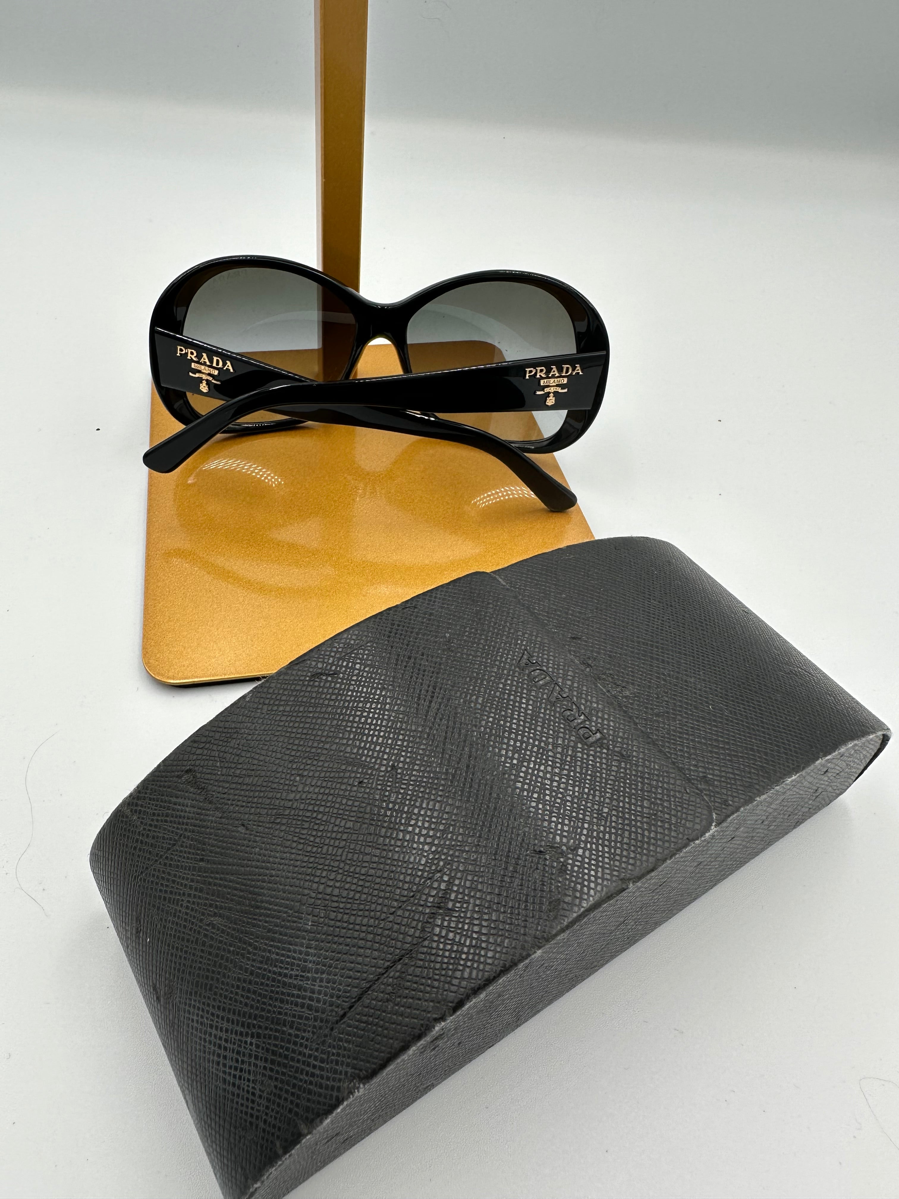 Prada Heritage black sunglasses with gold logo