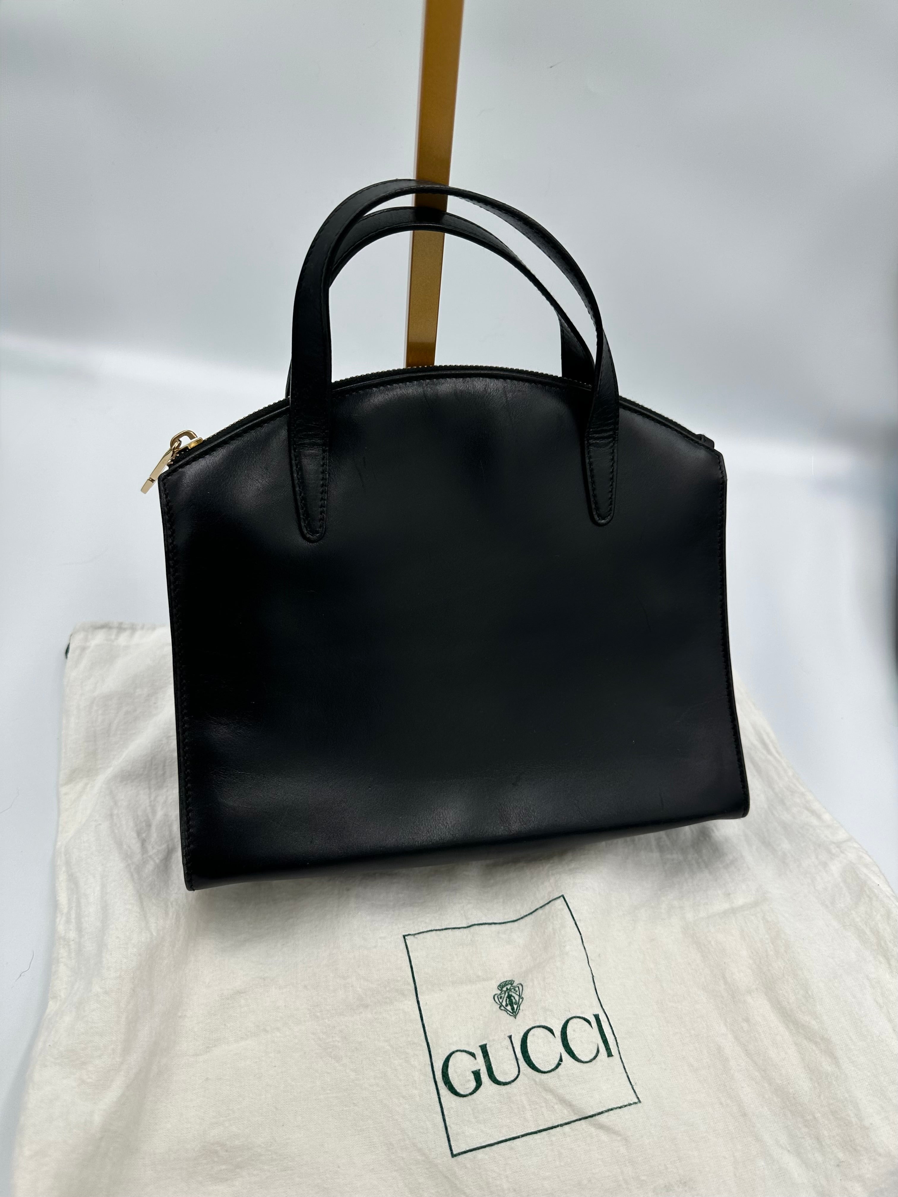 90’s Gucci Jackie black leather handbag with G gold hardware zip