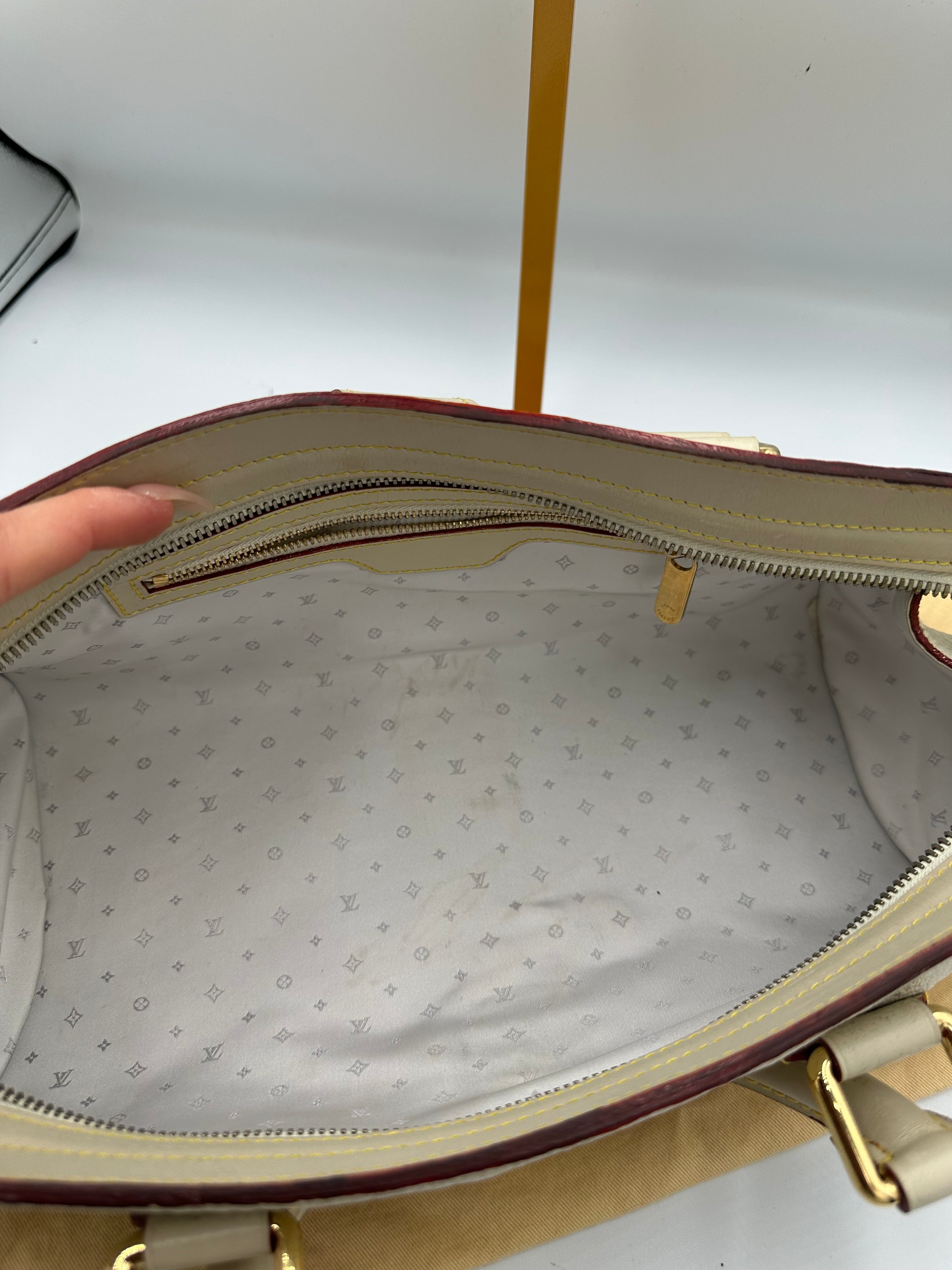 Louis Vuitton L'Epanoui PM handbag crafted from white Suhali goat leather